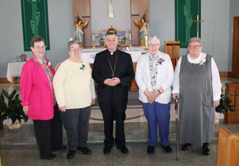Following the ceremony, Bishop Medley posed with the four jubilarians present. From left are Ursuline Sister Sharon Sullivan (40 years), Ursuline Sister Rose Jean Powers (60 years), Ursuline Sister Ruth Gehres (70 years) and Glenmary Sister Pat Leighton (40 years).