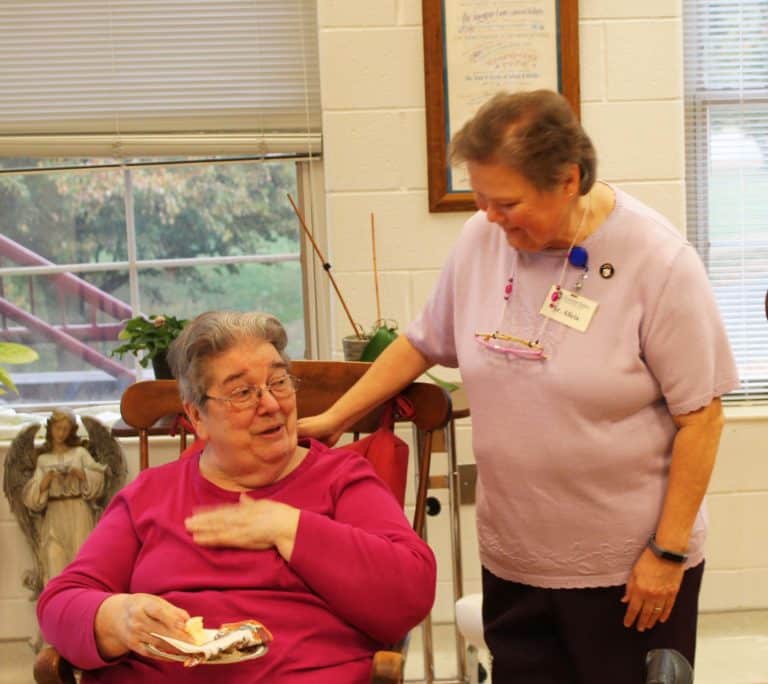 Sister Alicia draws a laugh from Sister Rose Jean Powers after thanking her for “putting up with me.”