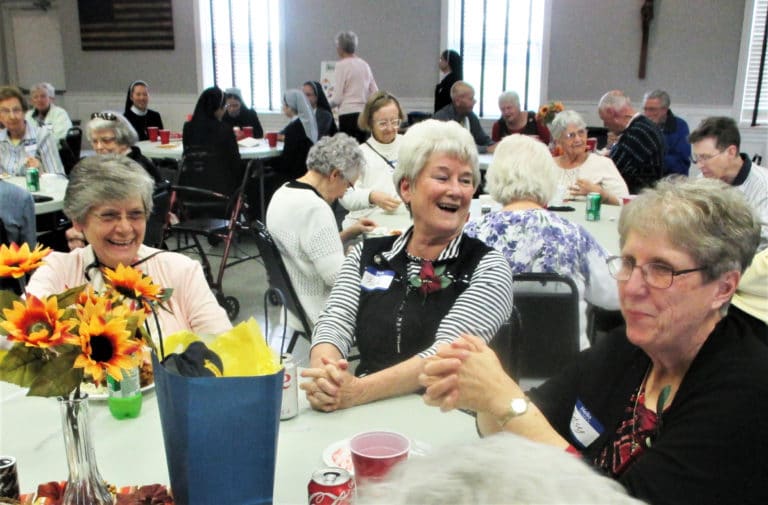 Sisters Cheryl Clemons, Pam Mueller and Betsy Moyer share a laugh over lunch.