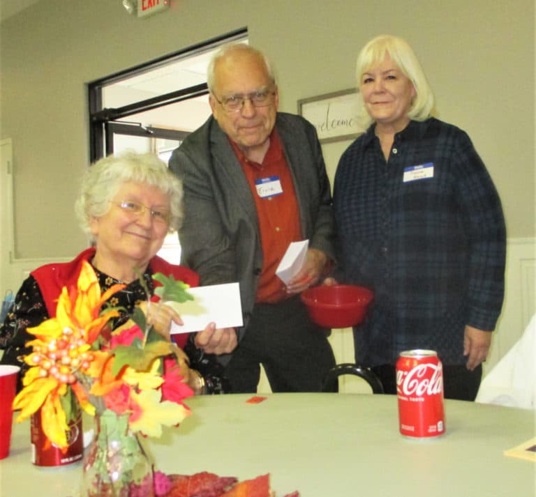 Sister Francis Louise Johnson receives her prize from Ernie Taliaferro and Diane Head of the Serra Club.