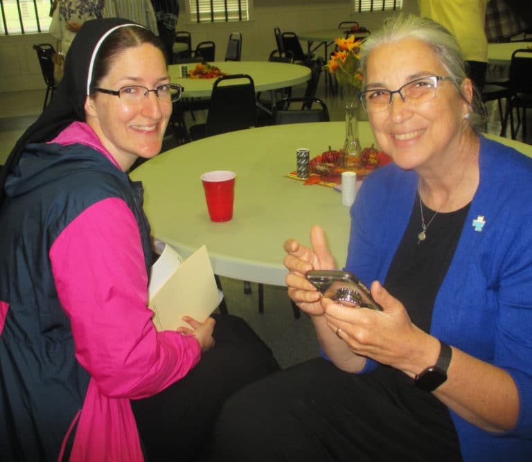 Benedictine Sister Jeana Visel, left, and Ursuline Sister Larraine Lauter share time together.