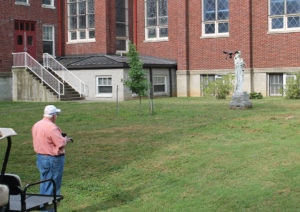 Father Ray Goetz, chaplain at the Motherhouse, prepares to launch his drone to get photos and videos of the tree razing.