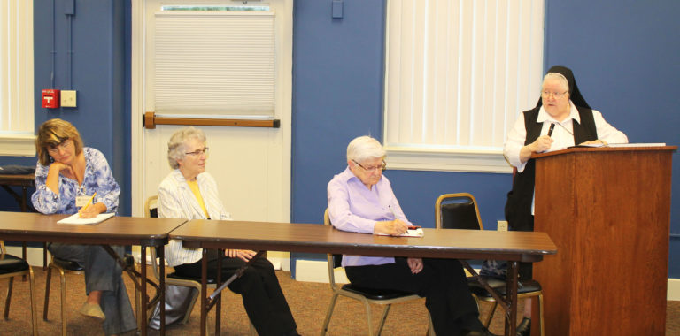 Sister Catherine Marie, right, tells the audience that when she came to the Academy, the music room was in the first chapel on campus. From left are Lisa Sills, the new Retreat Center coordinator, Sister Ann Patrice Cecil and Sister George Mary Hagan.