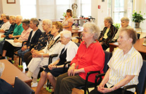The sisters were asked to join in singing “Salve Regina” in Latin to end the performance, and they were happy to do so. Singing here, from right, are Sisters Marie Carol Cecil, Francis Louise Johnson, Clarita Browning, Elaine Burke, Eva Boone, Nancy Murphy, Luisa Bickett, Mary Jude Cecil, Fran Wilhelm, Lois Lindle and Marie Goretti Browning. In back are Sisters Sheila Anne Smith and Catherine Barber.
