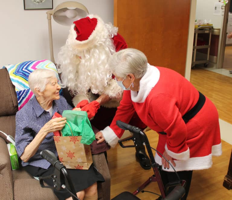 Sister Clarita Browning assures Santa and Mrs. Claus that she has been very good this year. Her second mission was as a teacher in Paducah from 1951-55. She will celebrate 75 years as an Ursuline in 2023.
