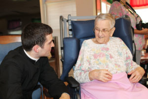 Sister Dorothy Helbling shares a smile with Abbe Christian Juneau, one of the counselors at the camp.