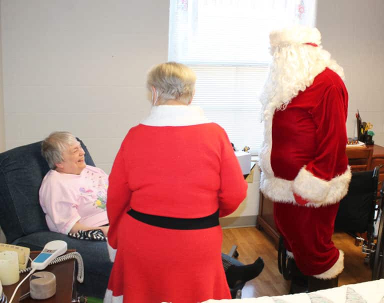 Sister Kathy Stein gets a laugh during her conversation with Santa.