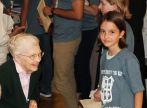 Sister Mary Irene Cecil smiles while talking with this youngest camper, who is just 9 years old.
