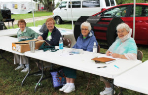 This is one of many crews of Ursuline Sisters who braved some chilly and damp weather to sell Mount Raffle tickets. From left are Sisters Elaine Burke, Helena Fischer, Barbara Jean Head and Cecelia Joseph Olinger.