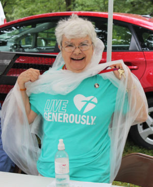Sister Cecelia Joseph Olinger passed on an Eastbridge volunteer T-shirt so she could wear her “Live Generously” shirt.