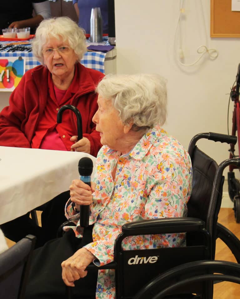 Sister Grace Swift led the singing of Sister Marie’s favorite song, “Springtime in the Rockies.” Sister Francis Louise Johnson joins in the singing at left.