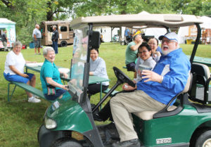 : Everyone gets a big laugh from whatever Father Ray Goetz said from his golf cart. At left are Ursuline Sisters Karla Kaelin and Pam Mueller, along with three of the sisters from Vietnam who live at the Mount.