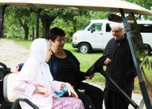 Sister George Mary Hagan, right, laughs with Ursuline Associate Bonnie Marks, center, and Sister Amanda Rose Mahoney. Marks drove some of the sisters through the park, so they could see the festival.
