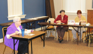 Sister Ann McGrew, left, director of the Retreat Center, listens to a question as participants Mary Lou Payne, center, and Rachel Boultinghouse smile at a comment.