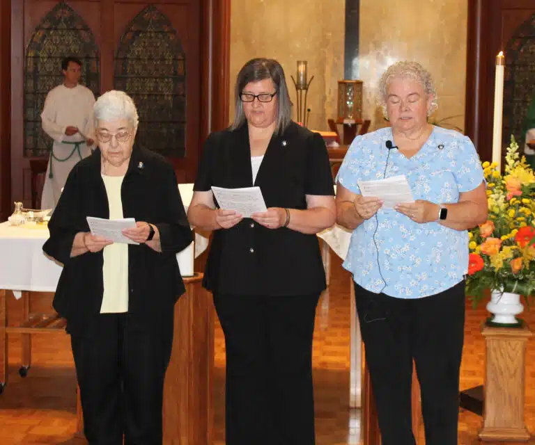 The three outgoing members of the Leadership Council – from left, Sisters Ann McGrew, Monica Seaton, and Martha Keller – read from Saint Angela Merici’s Prologue to the Rule, “Blessed are you into whose hearts God has breathed the light of truth, and to whom God has given the will to yearn ardently for your heavenly home. Seek to preserve and follow the voice of truth and this holy desire.” The three outgoing members of the Leadership Council – from left, Sisters Ann McGrew, Monica Seaton, and Martha Keller – read from Saint Angela Merici’s Prologue to the Rule, “Blessed are you into whose hearts God has breathed the light of truth, and to whom God has given the will to yearn ardently for your heavenly home. Seek to preserve and follow the voice of truth and this holy desire.”