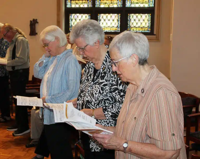 The entire congregation read a response to the outgoing Council. Pictured here, from right, are Sisters Rita Scott, Mary Timothy Bland, and Nancy Liddy. The entire congregation read a response to the outgoing Council. Pictured here, from right, are Sisters Rita Scott, Mary Timothy Bland, and Nancy Liddy.