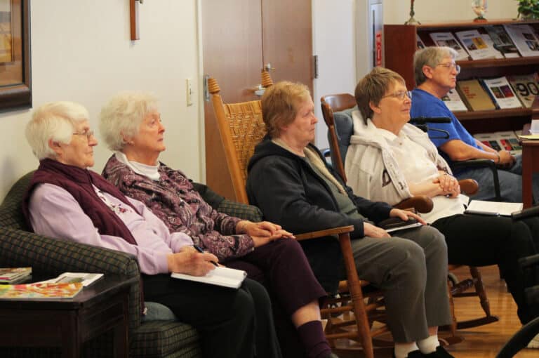 “Sometimes we think we have to walk into the chapel with it all together,” Father Mullen told the Sisters. “We have to be perfectly holy. We’re in for a lot of disappointment.” Listening to that message are, from left, Sisters Mary Matthias Ward, Vivian Bowles, Helena Fischer, Amelia Stenger and Emma Anne Munsterman.