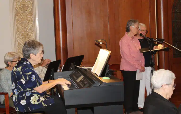Sister Cheryl Clemons, left, played the piano as Sisters Mary Ellen Backes and Suzanne Sims led the singing during Mass. Sister Cheryl Clemons, left, played the piano as Sisters Mary Ellen Backes and Suzanne Sims led the singing during Mass.