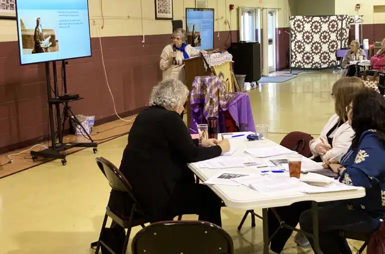 Sister Martha Keller, at left in black, takes notes as Sister Cheryl discusses one of the Saint Teresas. Sister Martha provided spiritual direction to participants throughout the day. Sister Martha Keller, at left in black, takes notes as Sister Cheryl discusses one of the Saint Teresas. Sister Martha provided spiritual direction to participants throughout the day.