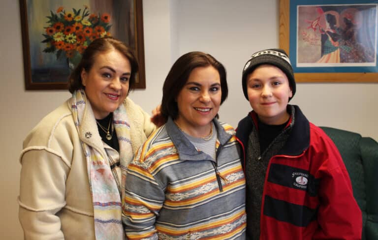 Fanny Gonzalez, center, with her sister Gladys and her son Matias, during her visit to Maple Mount on March 14, 2023.