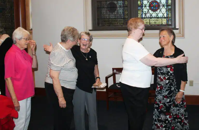 The new Council greeted a steady stream of well-wishers. From right, Sister Alicia Coomes gets a hug from Sister Helena Fischer, Sister Judith Nell Riney greets Sister Betsy Moyer, while Sister Barbara Jean Head waits her turn. The new Council greeted a steady stream of well-wishers. From right, Sister Alicia Coomes gets a hug from Sister Helena Fischer, Sister Judith Nell Riney greets Sister Betsy Moyer, while Sister Barbara Jean Head waits her turn.