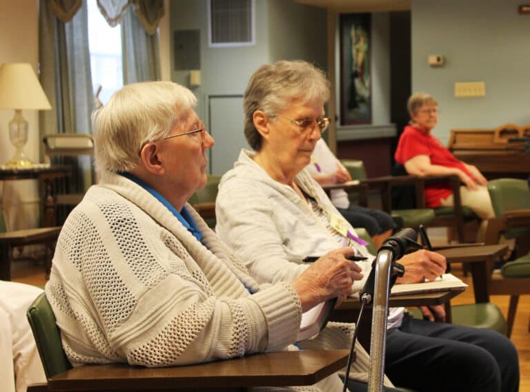 Sister Grace Simpson, left, and Sister Mary Ellen Backes listen to Cackie Upchurch. “The bible isn’t about people searching for God. It’s about God seeking us,” Upchurch said. Sister Grace Simpson, left, and Sister Mary Ellen Backes listen to Cackie Upchurch. “The bible isn’t about people searching for God. It’s about God seeking us,” Upchurch said.