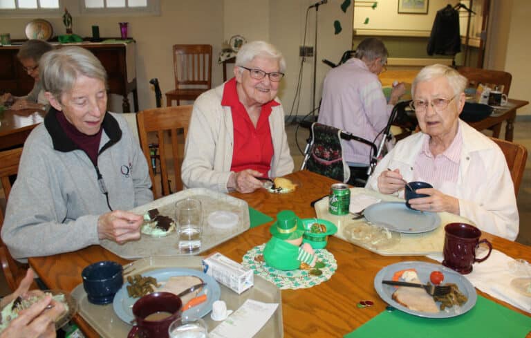 Sister Maureen O’Neill, left, Sister George Mary Hagan, center, and Sister Marie Bosco Wathen smile during the celebration.