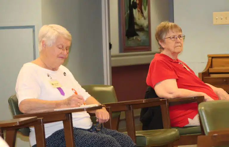 Sister Suzanne Sims, left, and Sister Melissa Tipmore listen to Upchurch say that we often feel unworthy of God’s attention. “I think we think God wants to pick someone holy or mystical. We expect something miraculous, something big.” Sister Suzanne Sims, left, and Sister Melissa Tipmore listen to Upchurch say that we often feel unworthy of God’s attention. “I think we think God wants to pick someone holy or mystical. We expect something miraculous, something big.”
