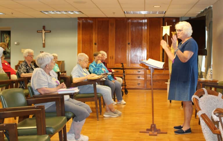 Cackie Upchurch talks with the Sisters in Saint Ursula Hall, using the example of Jacob’s ladder to make a point. Cackie Upchurch talks with the Sisters in Saint Ursula Hall, using the example of Jacob’s ladder to make a point.