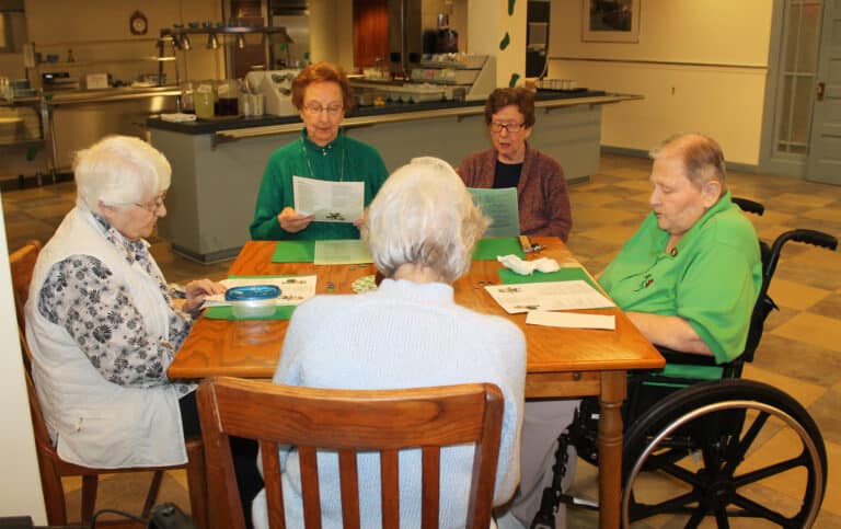 The music was merry as these Ursuline Sisters sang along with a few Irish tunes, including “Oh Danny Boy” and “When Irish Eyes are Smiling.” Seated, left to right, are Sister Mary Matthias Ward, Sister Susan Mary Mudd, Sister Mary Henning, Sister Kathleen Dueber, and (back to camera) Sister Elaine Burke.