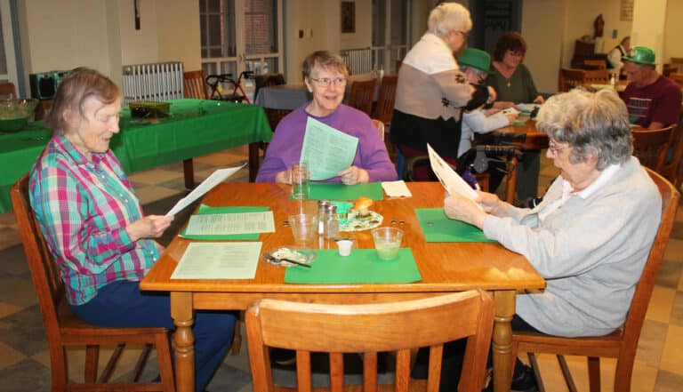 These Sisters enjoy singing along to “It’s a Long Way to Tipperary” during the party. Left to right are Sister Marie Carol Cecil, Sister Melissa Tipmore, and Sister Luisa Bickett.