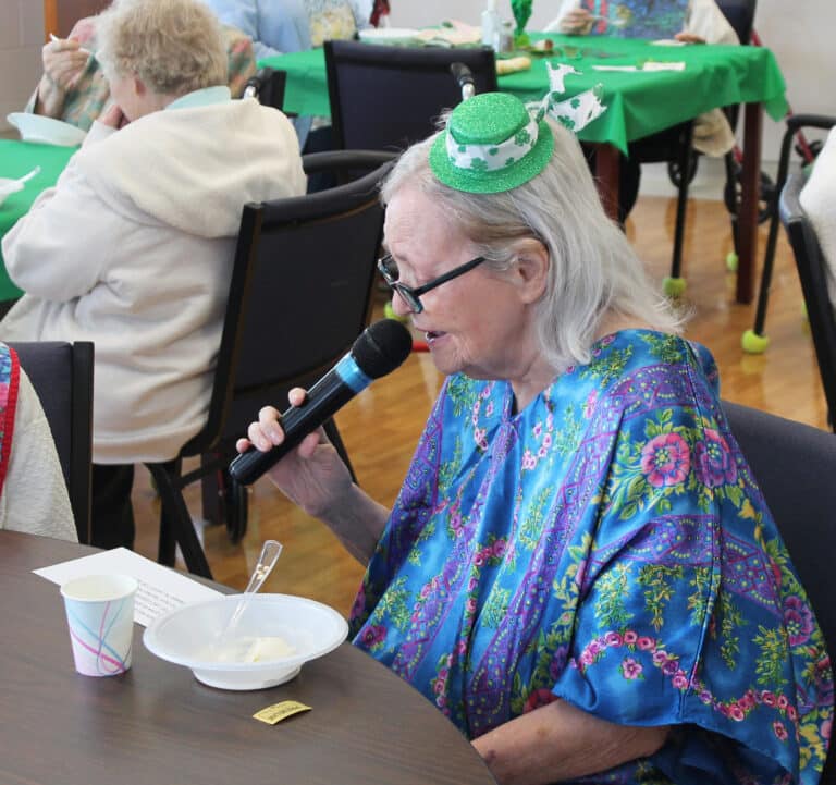 Sister Pat Rhoten, donning her lucky Irish hat, used a convincing accent to read her rhyme.