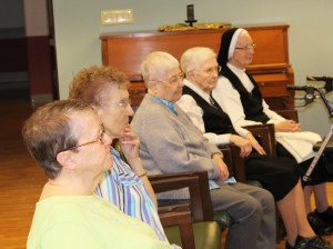 From left, Sisters Melissa Tipmore, Marie Carol Cecil, Marcella Schrant, Mary Irene Cecil, and Emerentia Wiesner reflect on Bishop Medley's words.