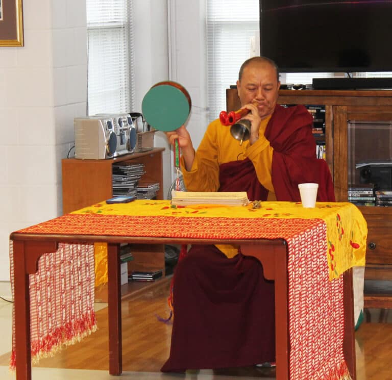 Following his chanting of his Buddhist scripture, Tsering plays the damaru (drum), dilbu (bell) and the kangling (flute).