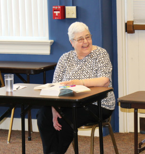 Sister Ann McGrew smiles at a comment one of the participants made.
