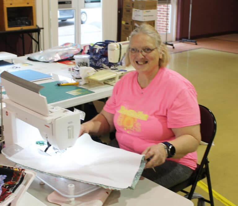 Ann Jacobs is busy at the sewing machine making one of the 85 aprons she is making for the Sisters in Saint Joseph Villa.
