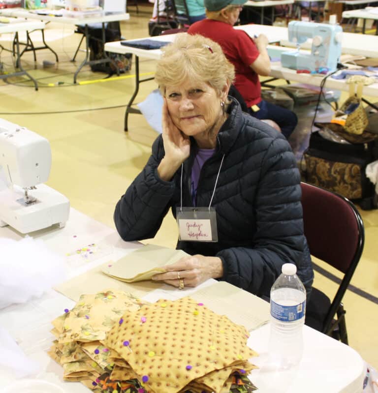 Judy Hayden of Calhoun, Ky., works on squares during her first experience with the Quilting Friends. “I love it,” she said.