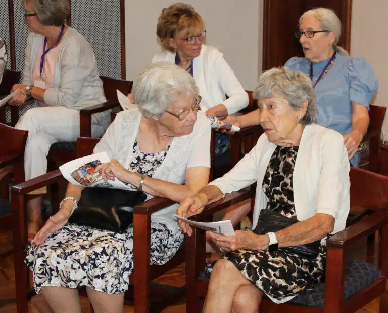 Peggy Murphy McCarty, left, talks with Jeannie Calhoun, her classmate from the class of 1956, prior to Mass beginning. In back are 1976 classmates Sheryl Sattazahn Thomas, left, and Cheryl Calhoun Crisp. Peggy Murphy McCarty, left, talks with Jeannie Calhoun, her classmate from the class of 1956, prior to Mass beginning. In back are 1976 classmates Sheryl Sattazahn Thomas, left, and Cheryl Calhoun Crisp.