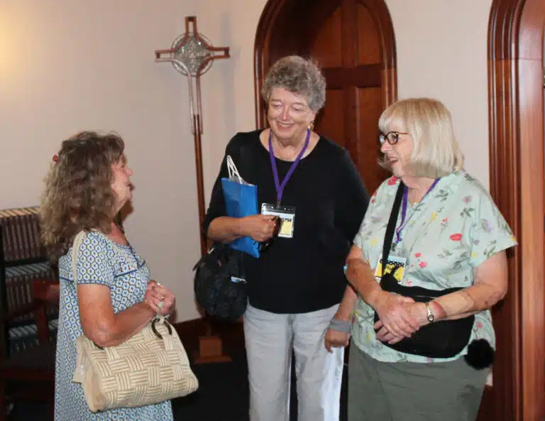 1966 classmates, from left, Mary Margaret Drury, Cecilia Robinette McEldowney, and Phyllis Costello Bresnik share a laugh before Mass. They were celebrating their 60th reunion year. 1966 classmates, from left, Mary Margaret Drury, Cecilia Robinette McEldowney, and Phyllis Costello Bresnik share a laugh before Mass. They were celebrating their 60th reunion year.