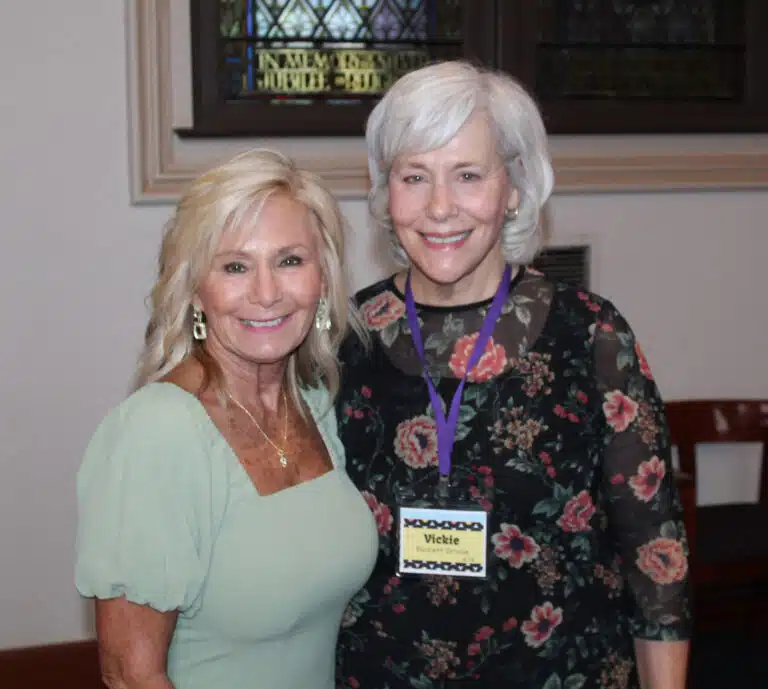Alumnae Association officers Lisa Calhoun Mulligan, left, and Vickie Bickett Groce welcomed people to Mass. Alumnae Association officers Lisa Calhoun Mulligan, left, and Vickie Bickett Groce welcomed people to Mass.