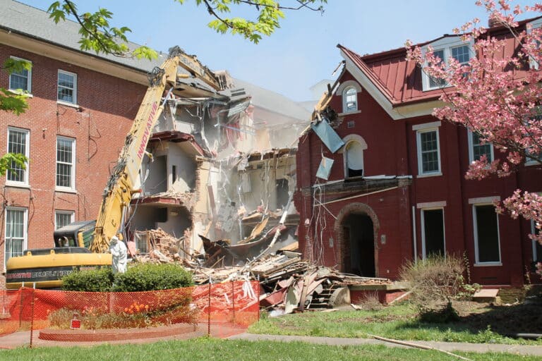 Much of the left side of the original building was down by 1:15 p.m.