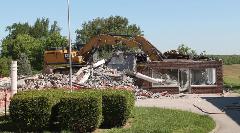 On the morning of May 3, the excavator burst through the roof of the former Student Shop/Gift Shop.
