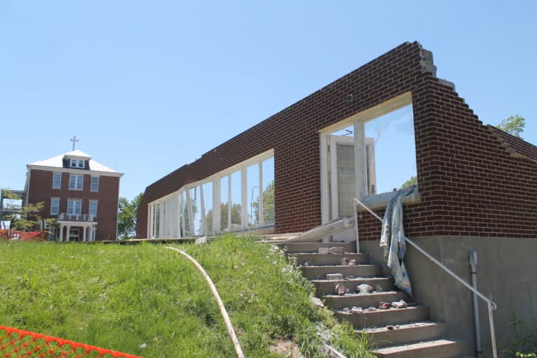 The view of the east facing wall, with St. Angela Hall in the background.