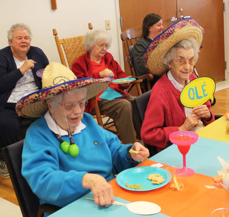 Sister Michael Ann Monaghan, left, has some maracas dangling from her hat, as Sister Mary Gerald Payne responds with “Ole!” Sister Michael Ann Monaghan, left, has some maracas dangling from her hat, as Sister Mary Gerald Payne responds with “Ole!”
