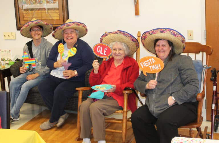 Wes Wheatley, from the food service department, joins (from left) Sister Martha Keller, Sister Francis Louise Johnson and Sister Monica Seaton for fiesta time. Wes Wheatley, from the food service department, joins (from left) Sister Martha Keller, Sister Francis Louise Johnson and Sister Monica Seaton for fiesta time.