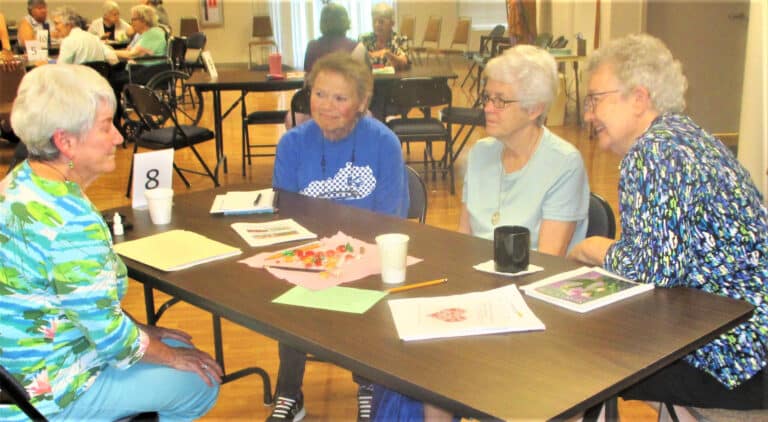 Sister Pam Mueller, left, has a captive audience listening to her, which consists of Sister Alicia Coomes, left, Sister Barbara Jean Head, center, and Sister Michele Morek.