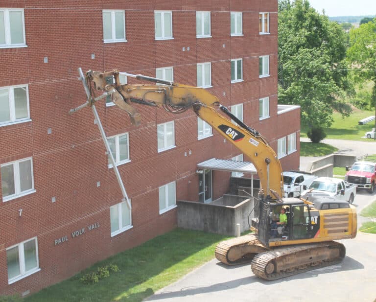The cross was pulled off the building in one piece by this excavator.