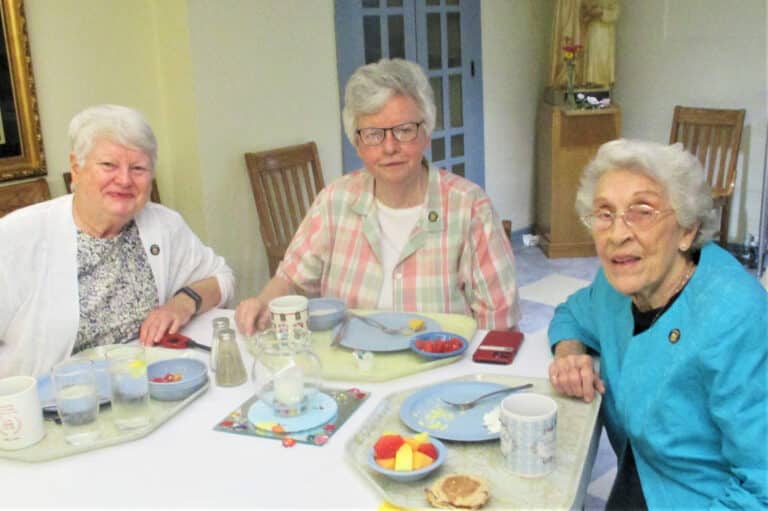 Sister Suzanne Sims, left, Sister Mary Timothy Bland, center, and Sister Elaine Burke enjoy their meals on jubilee day.