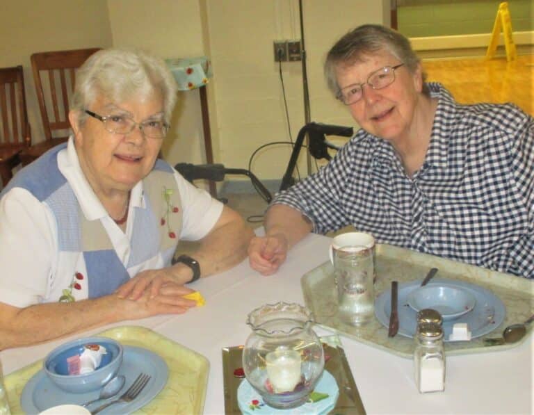 Sister Cecelia Joseph Olinger, left, enjoys meal time with Sister Melissa Tipmore on July 15. Sister Melissa celebrated her birthday the following day.