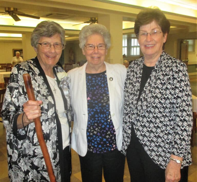 Sister Margaret Ann Aull, left, Sister Nancy Murphy, center, and Sister Laurita Spalding are all smiles in the dining room on July 15. Sister Margaret Ann is celebrating 70 years as an Ursuline this year.